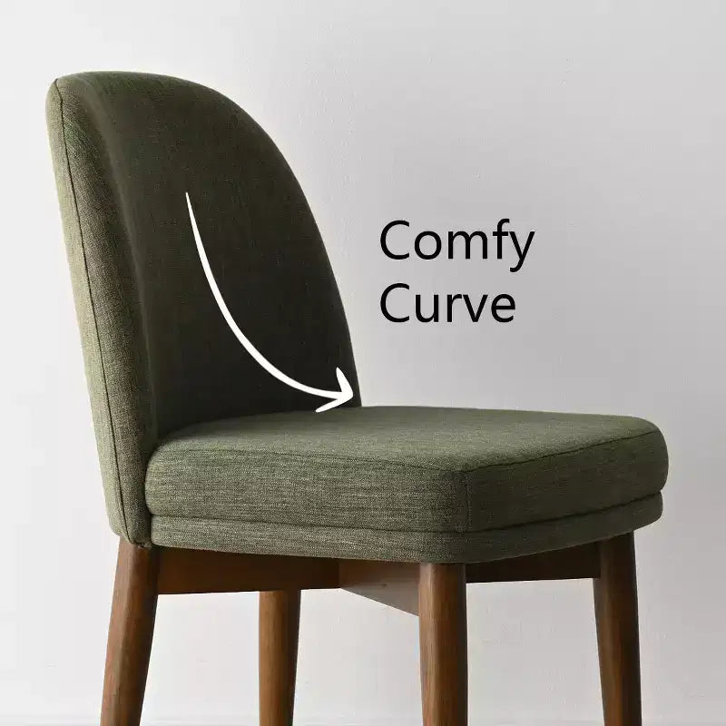 Table à manger ronde de style Mid-Century avec plateau en placage de noyer, piétement croisé en bois massif et chaises en lin avec pieds en bois massif.