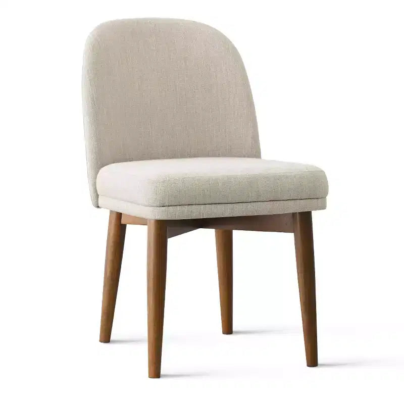 Table à manger ronde de style Mid-Century avec plateau en placage de noyer, piétement croisé en bois massif et chaises en lin avec pieds en bois massif.