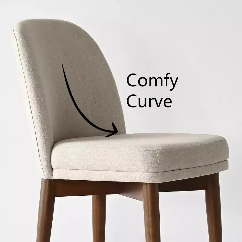 Table à manger ronde de style Mid-Century avec plateau en placage de noyer, piétement croisé en bois massif et chaises en lin avec pieds en bois massif.