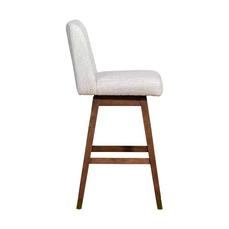 Tabouret de bar pivotant Basila en bois avec finition en tissu